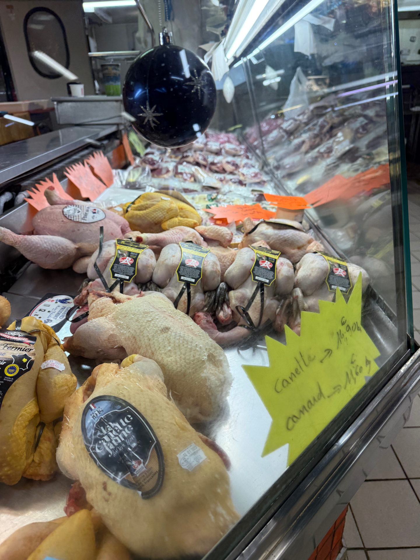 French poultry and game counter with duck, chicken and seasonal birds at a South of France market — chef-led sourcing for Bristol dinner parties