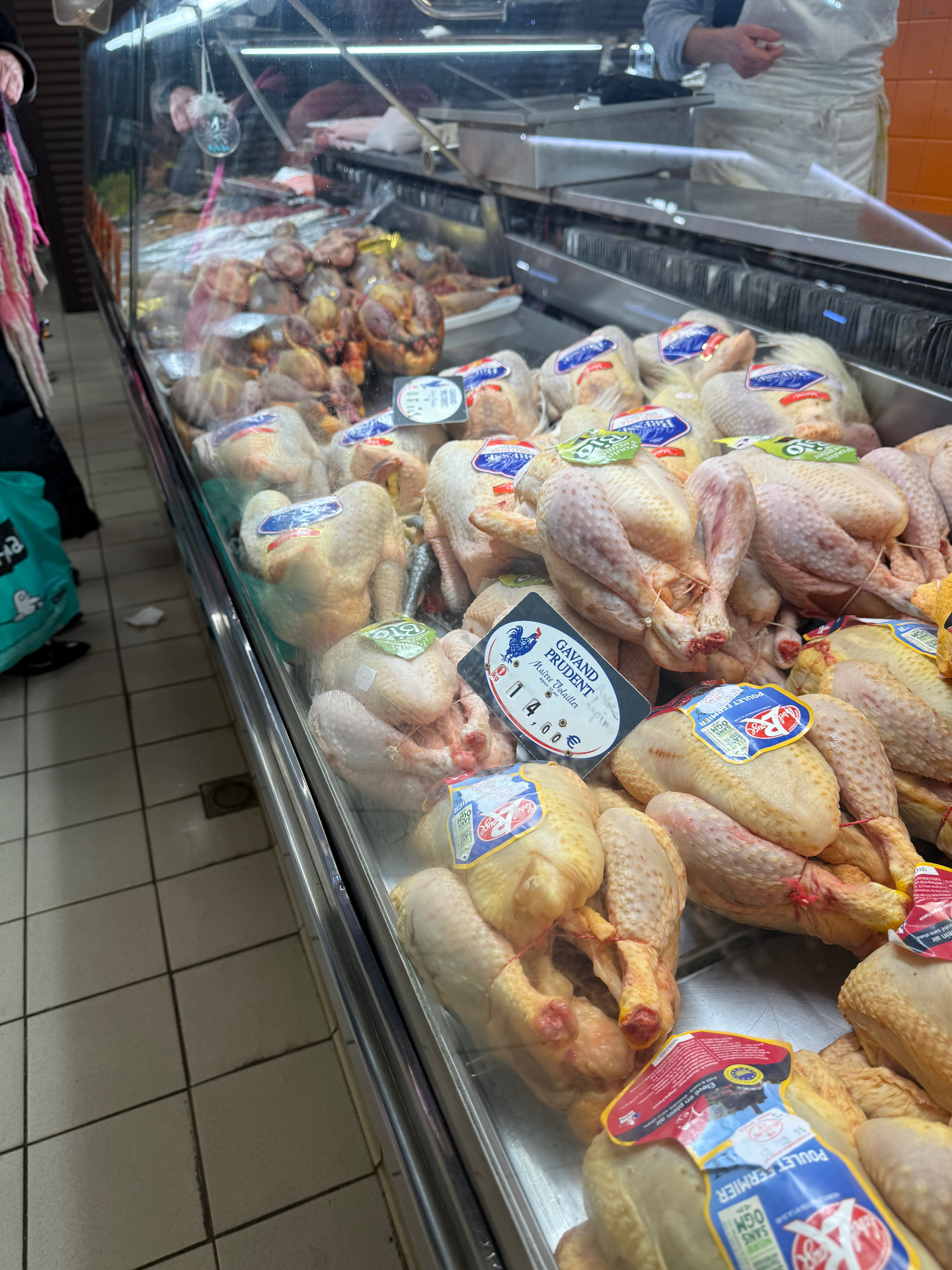 Label Rouge and organic free-range French poultry on display at a South of France market — the provenance standard Gus brings to Bristol personal chef menus