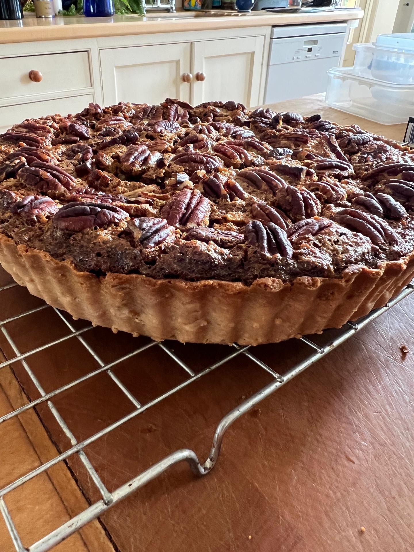 Deep maple pecan tart with whole toasted pecans on a butter shortcrust pastry case — an autumn dessert plated for a Lovey Chef private dinner in Bristol