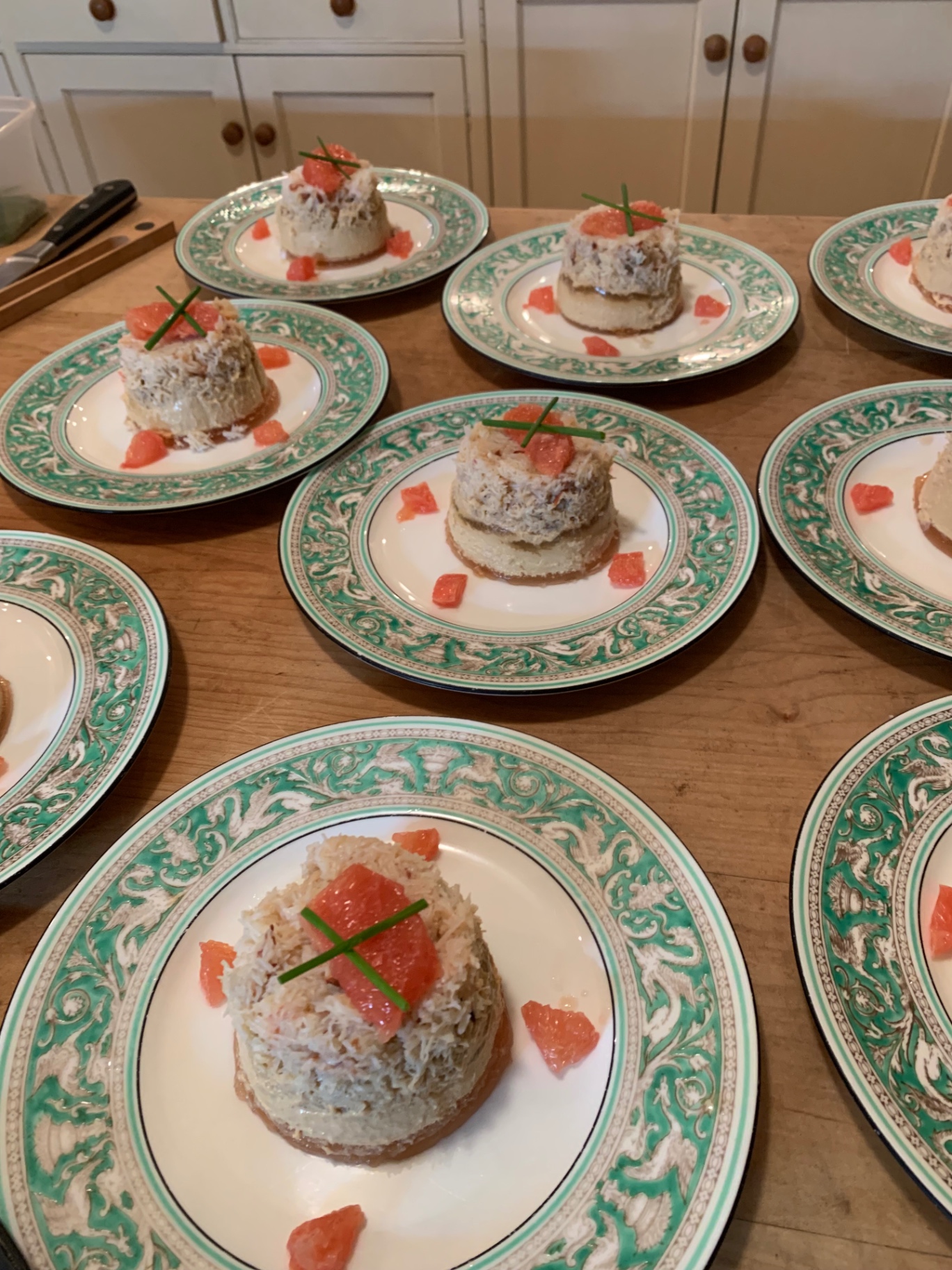 Dressed Devon crab on butter shortbread with pink grapefruit segments and chive cross — fine dining seafood amuse from a Lovey Chef private dinner